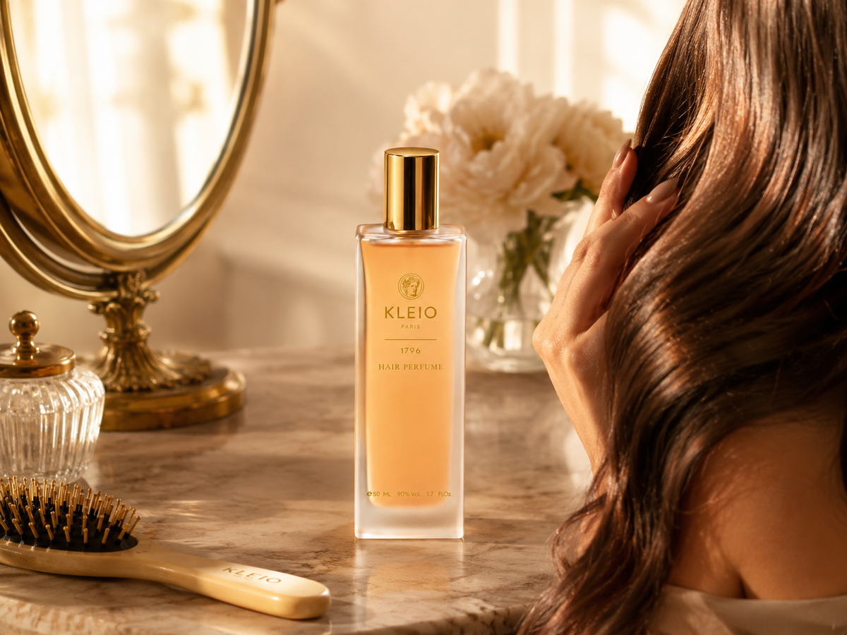 1796 Hair Perfume bottle beside a mirror, hair brush and dark hair